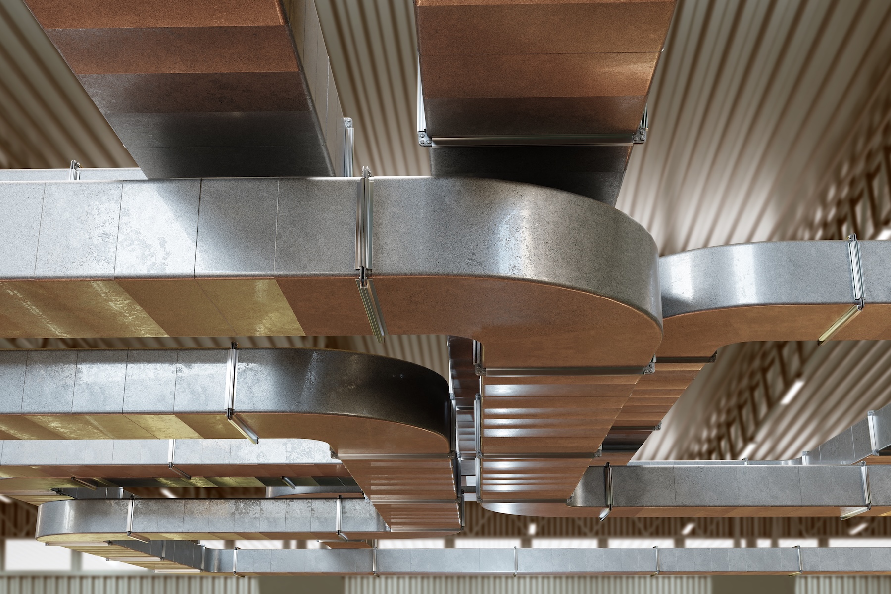 Ventilation ducts for air purification system in industrial building.