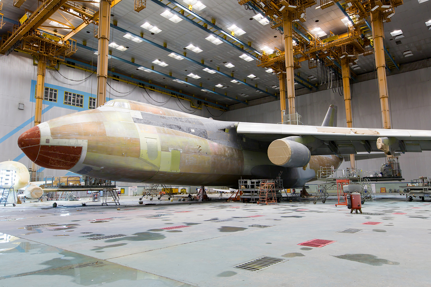an aircraft undergoes painting and maintenance